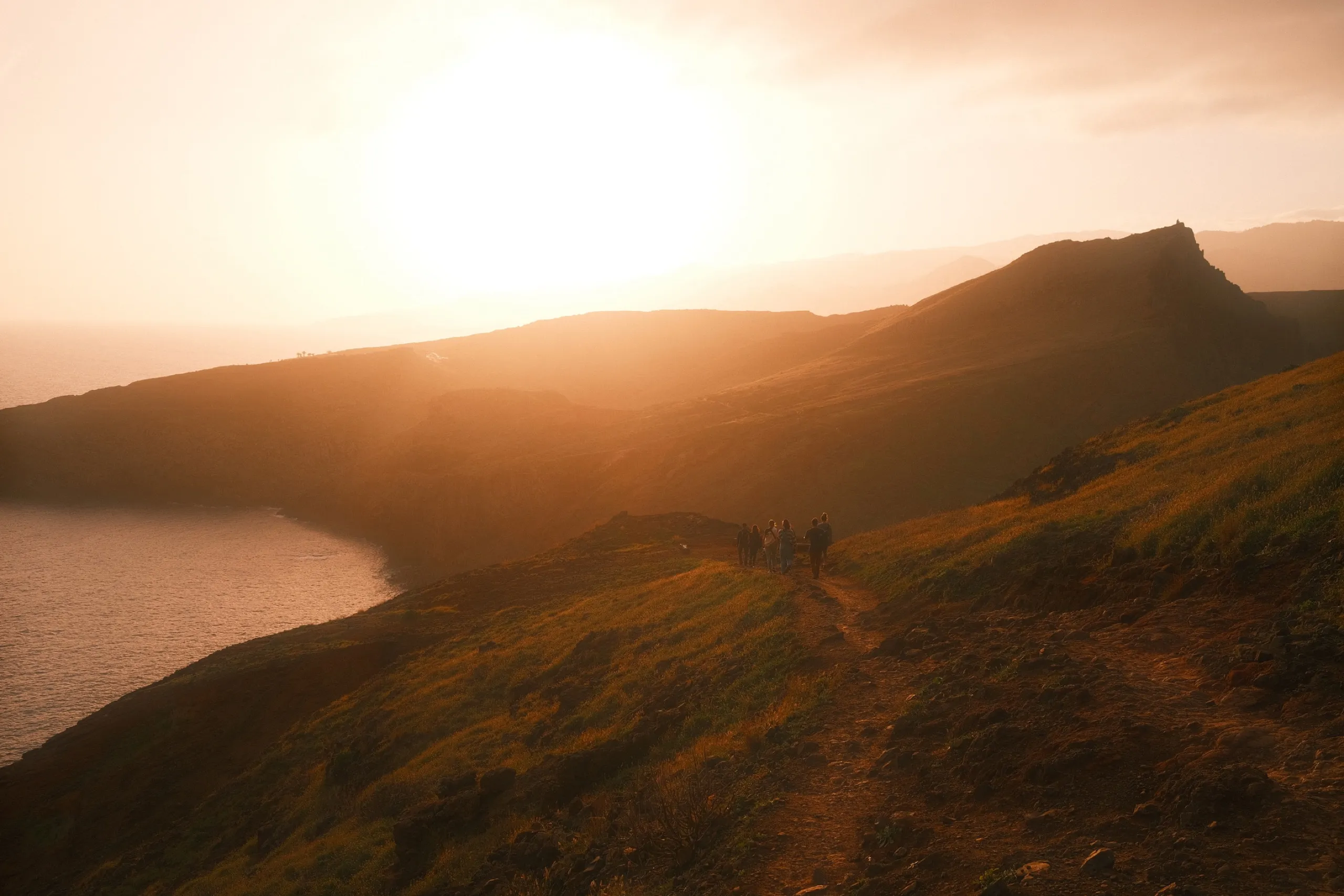 Residents walking the Ponta de São Lourenço ridge at sunset